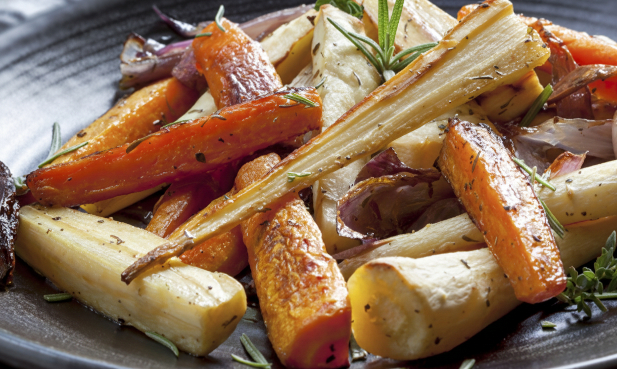 Roasted Baby Turnips with Bacon, Pine Nuts and Currants on a plate